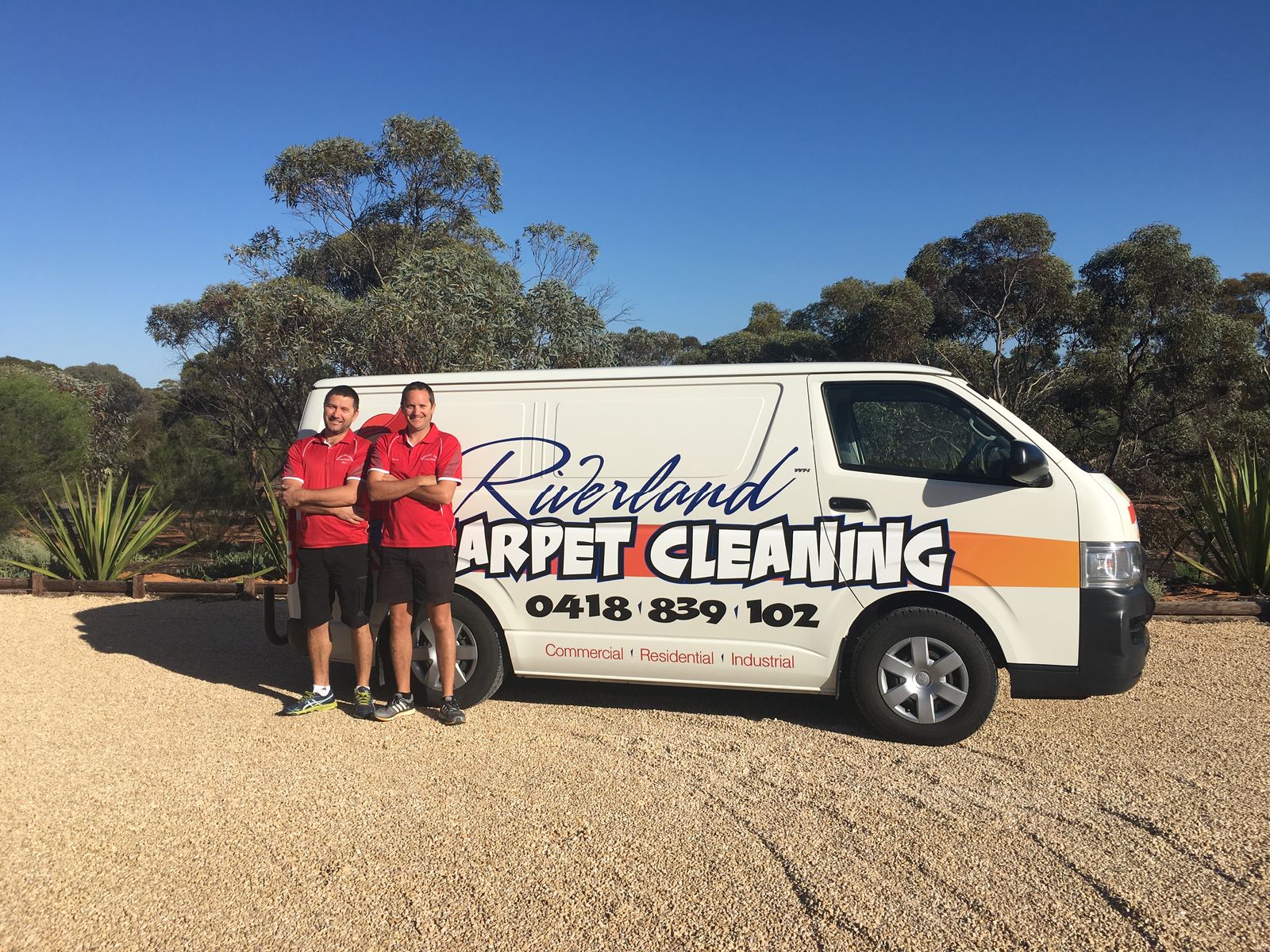 Dan and Tess standing beside the Riverland Carpet Cleaning van